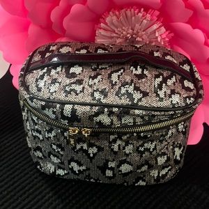 All Leopard sequined Toiletries/Cosmetics make up Bag. Black patten handle.